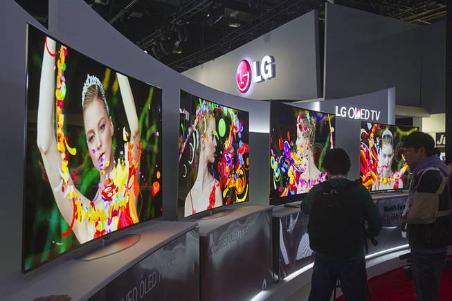 Curved 4K OLED televisions are displayed at the LG Electronics booth during the 2014 International Consumer Electronics Show (CES) at Las Vegas Convention Center in Las Vegas, Tuesday Jan. 7, 2014.