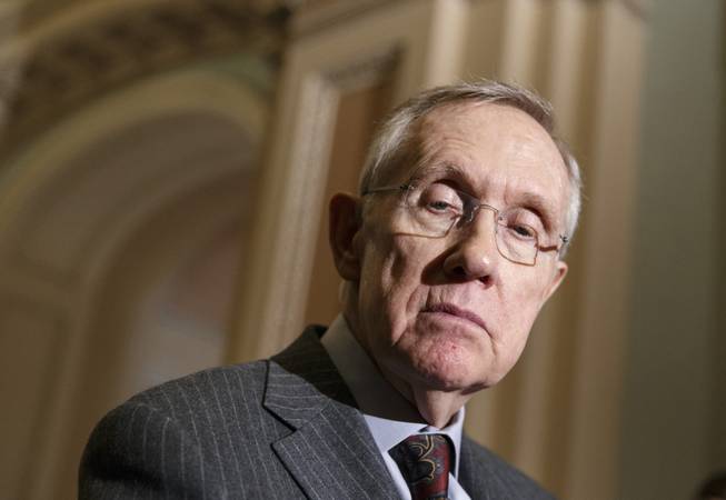 Senate Majority Leader Harry Reid pauses during a news conference on Capitol Hill in Washington, Tuesday, Jan. 7, 2014.
