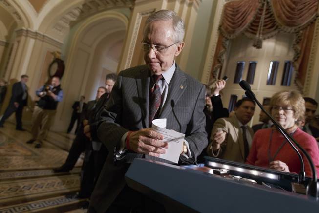 Senate Majority Leader Harry Reid of Nev. finishes a news conference on Capitol Hill in Washington, Tuesday, Jan. 7, 2014, where he said that he was pleased that six Republicans voted with the Democratic majority to proceed with legislation to renew jobless benefits for the long-term unemployed. 