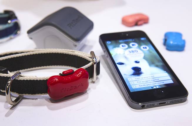 FitBark pet activity trackers are displayed during the 2014 International Consumer Electronics Show (CES) in Las Vegas, Jan. 8, 2014. The device uses a 3D accelerometer sensor to track your pet's activity. The device retails for $99.00 and is expected in stores in the first quarter of 2014.