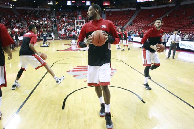 From left, UNLV forwards Chris Wood, Roscoe Smith and Carlos Lopez Sosa warm up for their Mountain West Conference game against UNR Wednesday, Jan. 8, 2014 at the Thomas & Mack Center