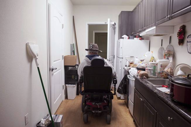 George Reimiller, an Army veteran, leaves his studio apartment at Victory Place, a community for homeless servicemen in Phoenix, Jan. 8, 2014.
