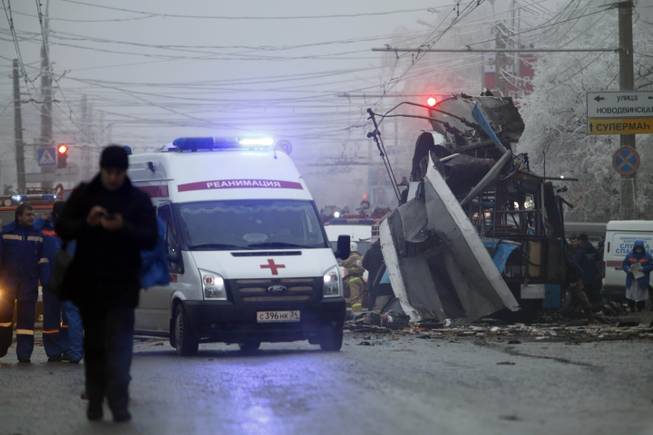 An ambulance leaves the site of a trolleybus explosion in Volgograd, Russia, Monday, Dec. 30, 2013. The explosion left 10 people dead, a day after a suicide bombing that killed at least 17 at the city's main railway. The explosions put the city on edge and highlighted the terrorist threat that Russia is facing as it prepares to host the Winter Games in February. Volgograd is about 650 kilometers (400 miles) northeast of Sochi, where the Olympics are to be held.