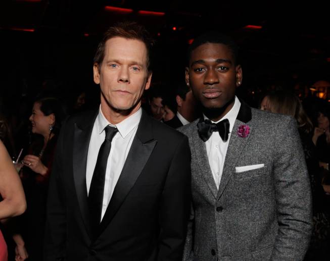 Kevin Bacon, left, and Kwame Boateng attend the FOX after party for the 71st Annual Golden Globes award show on Sunday, Jan. 12, 2014 in Beverly Hills, Calif. 