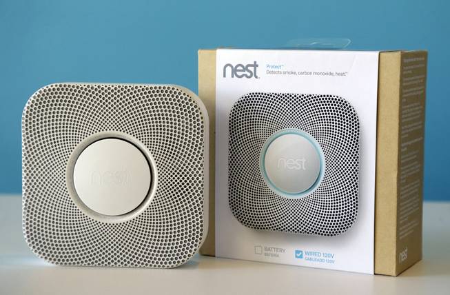 In this Tuesday, Oct. 1, 2013, file photo, the Nest smoke and carbon monoxide alarm is shown at the company's offices, in Palo Alto, Calif. 