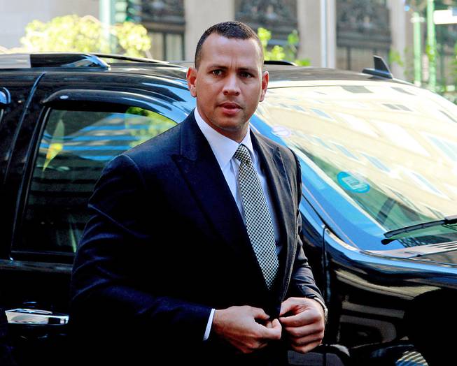 This Oct. 1, 2013, file photo shows New York Yankees' Alex Rodriguez arriving at the offices of Major League Baseball in New York.