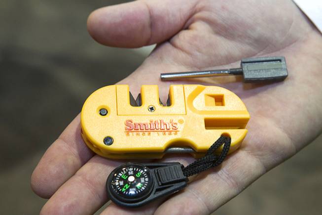 A Pocketpal X2 is displayed at the Smith's Consumer Product booth during the 2014 SHOT Show (Shooting, Hunting, Outdoor Trade) at the Sands Expo & Convention Center Tuesday, Jan. 14, 2014. The $15 survival tool includes a knife sharpener, a fire starter, an LED light, a compass and a signal whistle.