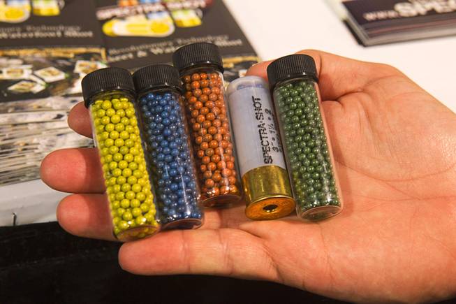 A variety of colored buckshot for waterfowl are displayed at the Spectra Shot booth during the 2014 SHOT Show (Shooting, Hunting, Outdoor Trade) at the Sands Expo & Convention Center Tuesday, Jan. 14, 2014. The different colors allow for accurate kill identification after the hunt with multiple shooters.