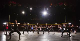 Male dancers run through a choreographed piece during 