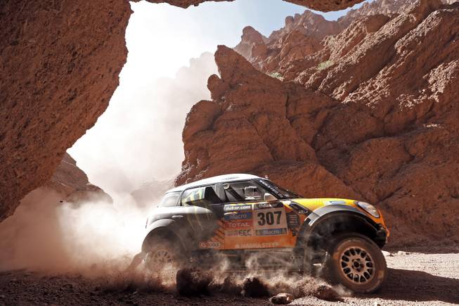 Mini driver Orlando Terranova of Argentina and co-pilot Paulo Fiuza of Portugal race during the Dakar Rally between the cities of San Miguel de Tucuman and Salta, Argentina, Friday, Jan. 10, 2014. 