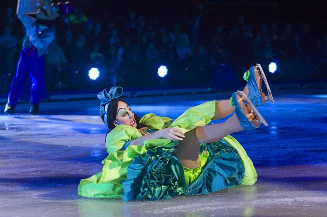 One of Cinderella's ugly stepsisters slides on the ice after falling during "Disney On Ice: Rockin' Ever After" at the Thomas & Mack Center Thursday, Jan. 16, 2014. The show plays at the center through Sunday.