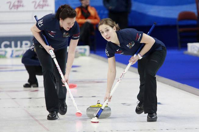 Ann Swisshelm, left, and Jessica Schultz sweep in front of their stone during the first day of the 2014 World Financial Group Continental Cup of Curling at the Orleans Arena Thursday, Jan. 16, 2014. Of the twelve teams competing from around the world, nine of them will represent their respective country at the upcoming Olympics in Sochi, Russia.
