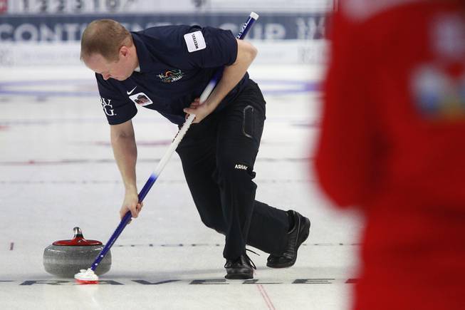 Mark Nichols sweeps during the first day of the 2014 World Financial Group Continental Cup of Curling at the Orleans Arena Thursday, Jan. 16, 2014. Of the twelve teams competing from around the world, nine of them will represent their respective country at the upcoming Olympics in Sochi, Russia.