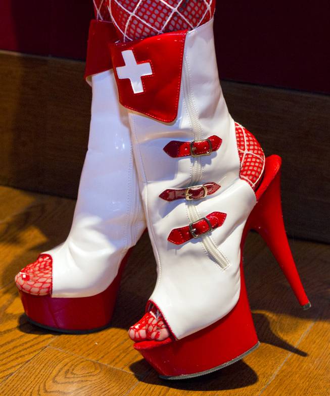 Leather red cross shoes are worn for the AVN Adult Entertainment Expo happening at the Hard Rock Hotel & Casino on Thursday , Jan. 16, 2014.