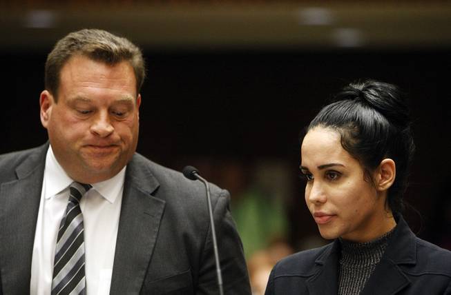 Nadya Suleman, right, appeares in a Los Angeles Superior courtroom with her attorney Arthur J. La Cilento Friday, Jan. 17, 2014. Suleman pleaded not guilty Friday to charges of failing to report $30,000 that authorities say she was earning when she applied for public assistance benefits. The 38-year-old single mother of 14 children was released on her own recognizance after her arraignment on three counts of welfare fraud.