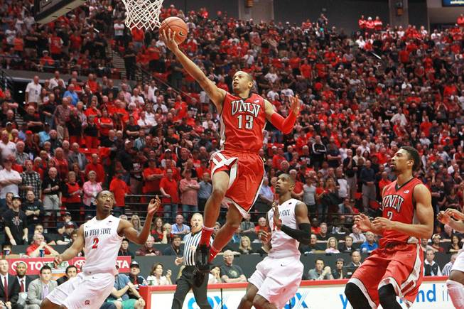 UNLV guard Bryce Dejean Jones drives in for an open layup, and misses, against SDSU during their game Saturday, Jan. 18, 2014 at Viejas Arena in San Diego.
