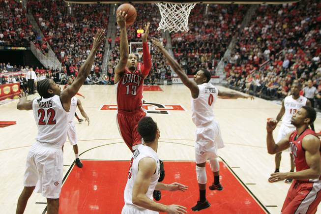 UNLV guard Bryce Dejan Jones drives to the basket, and misses, against San Diego State Saturday, Jan. 18, 2014 at Viejas Arena in San Diego. The 10th ranked SDSU won the game 63-52.