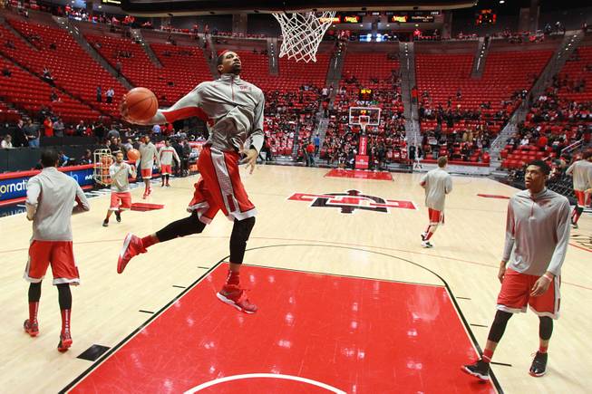 UNLV forward Khem Birch leaps toward the basket while warming up before the Rebels' game against San Diego State on Saturday, Jan. 18, 2014, at Viejas Arena in San Diego.