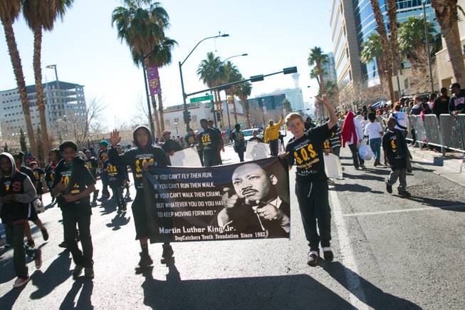Members of the Dogcatchers Youth Foundation march in the 32nd Annual Dr. Martin Luther King Jr. Parade, Monday Jan. 20, 2014.