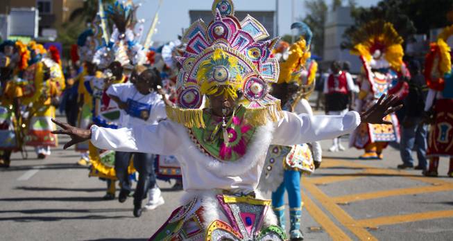 A member of a Caribbean carnival dance group marches in the MLK parade in Miami, Monday, Jan. 20, 2014. Dr. Martin Luther King, Jr. is honored across the country annually on the third Monday in January with Martin Luther King, Jr. Day. He was the most visible figure in the Civil Rights movement. 
