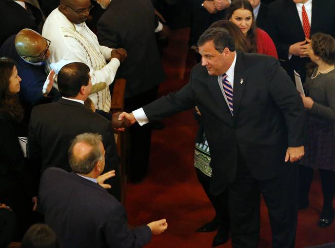 New Jersey Gov. Chris Christie shakes hands as he leaves a prayer service in celebration of his inauguration at the New Hope Baptist Church on Tuesday, Jan. 21, 2014, in Newark.