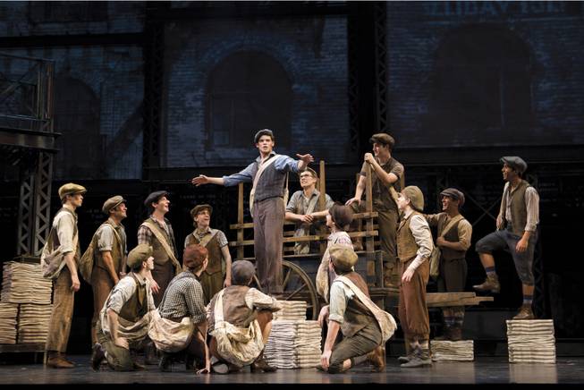 In this theater image released by Disney Theatricals, the cast of The Paper Mill Playhouse Production of "Newsies," starring Jeremy Jordan, center, is shown in New York.