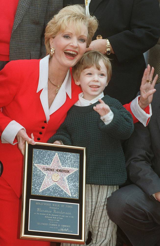 Actress Florence Henderson celebrates receiving the 2,061st star on the Hollywood Walk of Fame with her grandson Kyle Russell, 2, Wednesday, Feb. 14, 1996, in the Hollywood section of Los Angeles. Henderson, well-known for her role as Carol Brady on television's "The Brady Bunch," also celebrated her birthday on Wednesday. 