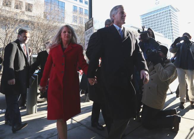 Former Virginia Gov. Bob McDonnell and his wife, Maureen, arrive at the U.S. District Court in Richmond on Friday, Jan. 24, 2014, for a bond hearing and arraignment on federal corruption charges. Federal prosecutors allege that the McDonnells accepted more than $165,000 worth of loans and gifts from Jonnie Williams, the former head of Star Scientific Inc.