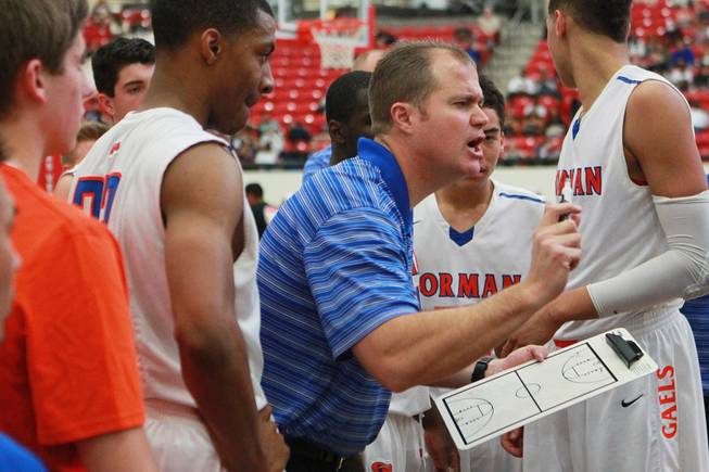 Bishop Gorman coach Grant Rice talks to his players during a time out in their game against  Findlay Prep Saturday, Jan. 25, 2014 at the South Point. Gorman won 76-72 in overtime.