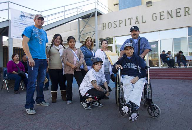 Francisco Diaz of Las Vegas poses with family members and assistant Jose Alberto Ramirez outside the general hospital after a doctor's appointment in Mexicali, Mexico Sunday, Jan. 26, 2014. Diaz was born in Mexico but grew up in Las Vegas with a green card. Diaz was beaten and robbed after he was deported to Mexicali.