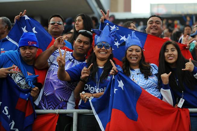 Samoan Rugby fans pose for a photo on the final day of the USA 7's rugby tournament at Sam Boyd Stadium on Sunday afternoon.