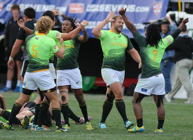 South African players celebrate after defeating New Zealand 14-7 in the Cup Final match of the USA Sevens Rugby tournament Sunday, Jan. 26, 2014, at Sam Boyd Stadium.