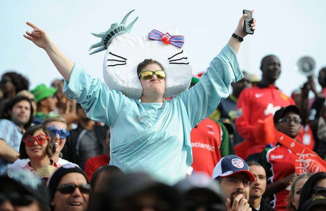 A costumed rugby fan dances in the crowd during the final day of the USA 7's rugby tournament at Sam Boyd Stadium on Sunday afternoon.