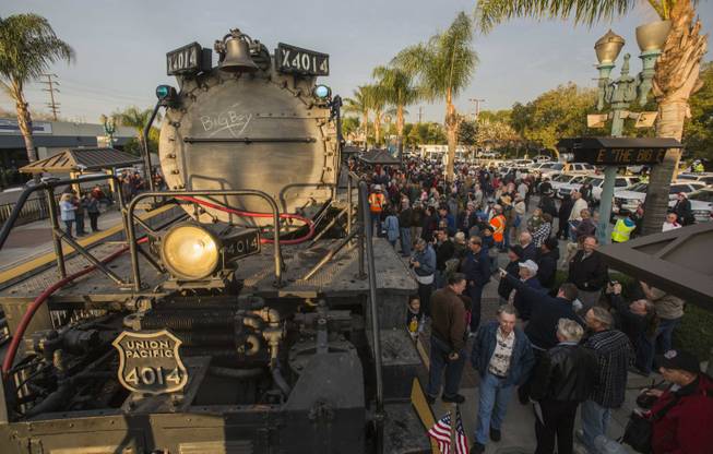 Spectators view the historic locomotive Union Pacific Big Boy No. 4014 at the Metrolink Station in Covina, Calif., on Sunday, Jan. 26, 2014. The locomotive will head for Colton over the next several weeks before No. 4014 departs for Union Pacific's Heritage Fleet Operations headquarters in Cheyenne, Wyo.