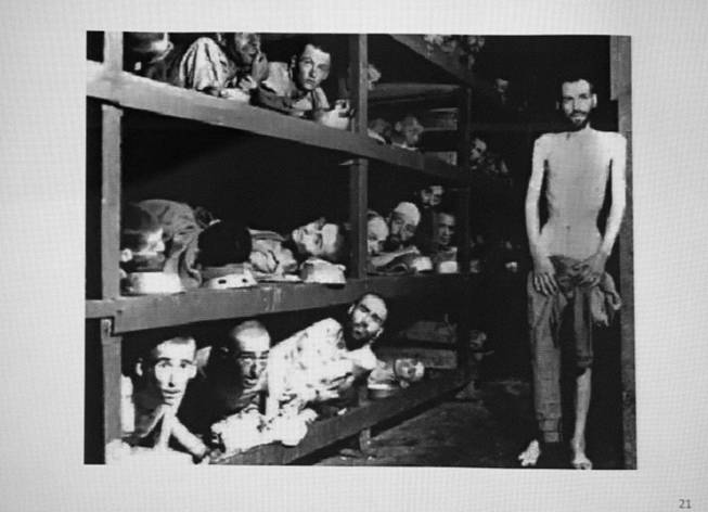 A photo of prisoners at the Bergen-Belsen concentration camp is shown during a presentation by Ret. Major Leonard Berney at Congregation Ner Tamid in Henderson Monday, Jan. 27, 2014. Berney was a member of British forces that liberated the concentration camp during Word War II. The presentation was part of International Holocaust Memorial Day.