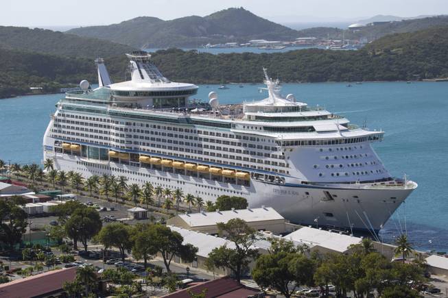 The Royal Caribbean International's Explorer of the Seas is docked at Charlotte Amalie Harbor in St. Thomas, U. S. Virgin Islands, Sunday, Jan. 26, 2014. U.S. health officials boarded the cruise liner to investigate an illness outbreak that hit at least 300 people with gastrointestinal symptoms including vomiting and diarrhea.