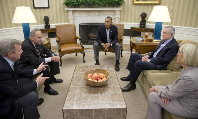  In this Oct. 12, 2013, file photo, from left, Sen. Dick Durbin, D-Ill., Sen. Charles Schumer, D-N.Y., President Barack Obama, Senate Majority Leader Harry Reid of Nevada, Sen. Patty Murray, D-Wash., meet in the Oval Office of the White House in Washington. When Obama delivers his State of the Union address on Jan. 28, 2014, he isn’t just setting out his own agenda. He’s also delivering an opening salvo in the yearlong fight for control of Congress.