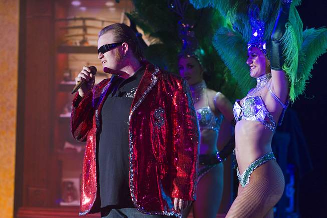 Lil' Boss (Gus Langley) performs with showgirls during a performance of "Pawn Shop Live!" at the Golden Nugget Thursday, Jan. 30, 2014. The production show is a parody based on the story of Gold & Silver Pawn, home of the History Channel's Pawn Stars television series.
