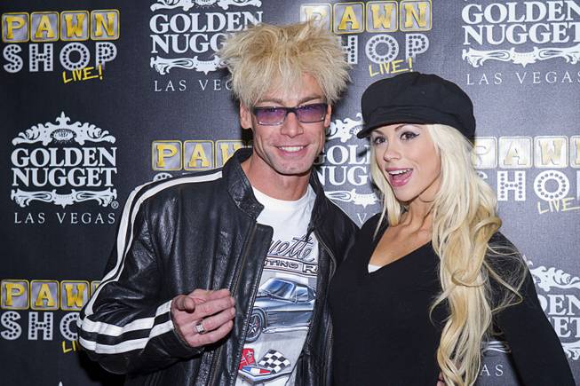 Magician/comedian Murray SawChuck, left, and his wife, entertainer Chloe Louise Crawford pose on the red carpet after a performance of "Pawn Shop Live!" at the Golden Nugget Thursday, Jan. 30, 2014. The production show is a parody based on the story of Gold & Silver Pawn, home of the History Channel's Pawn Stars television series.