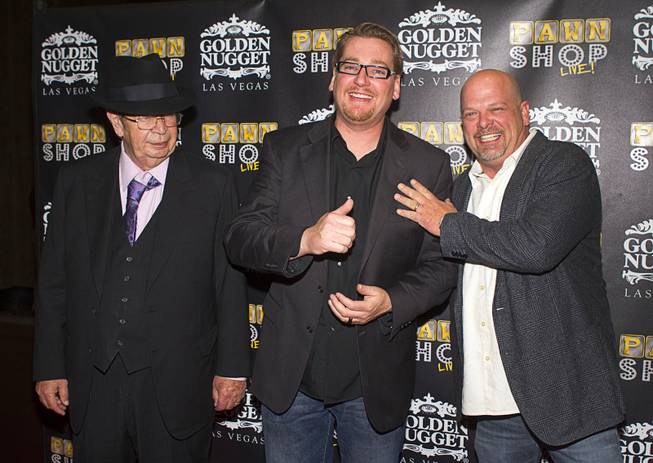 Richard "The Old Man" Harrison, left, Derek Stonebarger, center,and Rick Harrison pose on the red carpet after attending a performance of "Pawn Shop Live!" at the Golden Nugget Thursday, Jan. 30, 2014. The production show is a parody based on the story of Gold & Silver Pawn, home of the History Channel's Pawn Stars television series. Stonebarger is the co-writer and producer of the show.