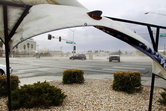 Wind blows dirt off a lot at the intersection of Main Street and Wyoming Avenue as a weather system moves through the valley Thursday, Jan. 30, 2014.