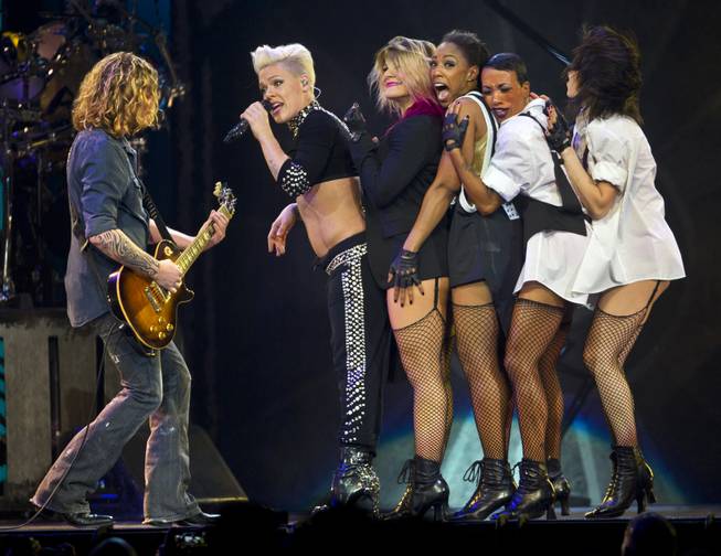 Pink performs with her dancers and guitarist Justin Derrico in front of a packed house at the MGM Grand Garden Arena on Friday, Jan. 31, 2014.