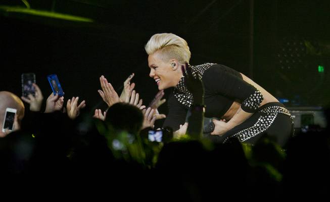 Pink interacts with the crowd during “The Truth About Love Tour” stop at MGM Grand Garden Arena Friday, Jan. 31, 2014.
