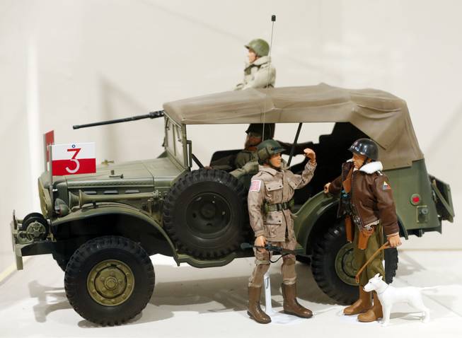 This Jan. 31, 2014, photo shows a Gen. George Patton G.I. Joe action figure, right, and other G.I. Joes in a display at the New York State Military Museum  in Saratoga Springs, N.Y. A half-century after the 12-inch doll was introduced at a New York City toy fair, the iconic action figure is being celebrated by collectors with a display at the military museum, while the toy's maker plans other anniversary events to be announced later this month.