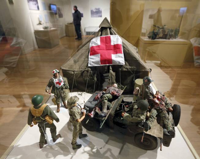 In this Friday, Jan. 31, 2014, photo, G.I. Joe action figures are arranged in a mobile army surgical hospital in a display at New York State Military Museum in Saratoga Springs, N.Y.
