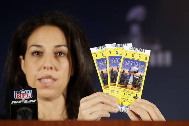 Anastasia Danias, with the NFL, speaks about the security features of Super Bowl XLVIII tickets during a news conference on counterfeit merchandise at the NFL Super Bowl XLVIII media center, Thursday, Jan. 30, 2014, in New York. 