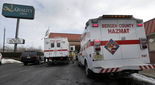 Emergency vehicles are parked outside a Quality Inn near the site of NFL Super Bowl XLVIII, Friday, Jan. 31, 2014, in Lyndhurst, N.J. White powder was mailed to businesses near the site of Sunday's Super Bowl, prompting an investigation by the FBI and other law enforcement.