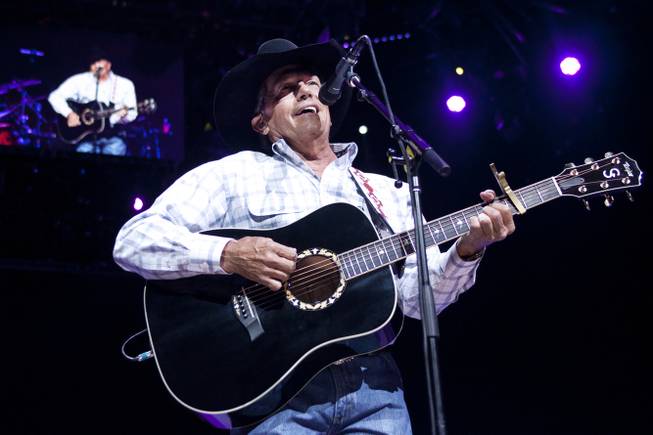 George Strait performs during his “The Cowboy Rides Away Tour” stop at MGM Grand Garden Arena on Saturday, Feb. 1, 2014.