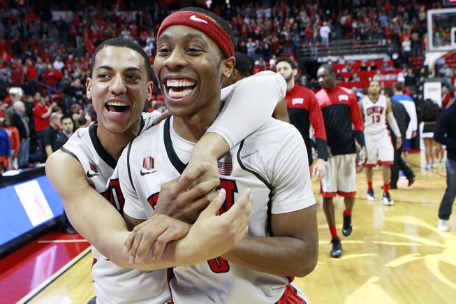 UNLV guard Kendall Smith hugs Kevin Olekaibe after defeating Boise State 73-69 in their Mountain West Conference game Saturday, Feb. 1, 2014 at the Thomas & Mack Center. Olekaibe sunk a three-point shot with seconds remaining to give the Rebels the lead for good.