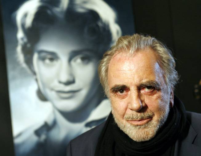 In this Jan. 30, 2007, file picture, actor Maximilian Schell poses in front of a poster of his sister Maria Schell in Frankfurt, Germany. Austrian actor Maximilian Schell, who won the best actor Oscar in the early 1960s for his portrayal of a defense attorney in the drama "Judgment at Nuremberg," has died. He was 83.